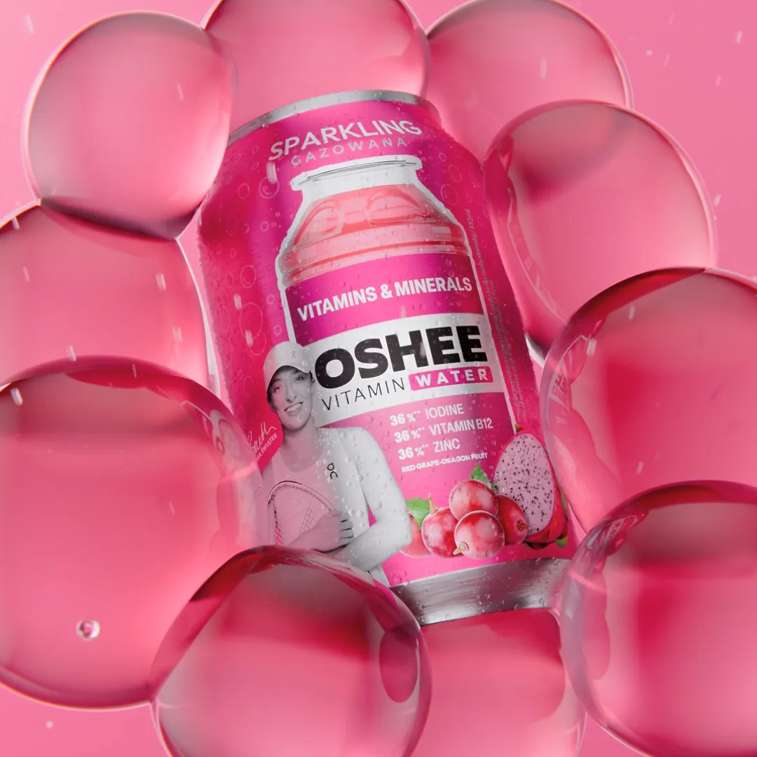 OSHEE Sparkling Vitamin Water can featuring tennis player Iga Świątek, red grape and dragon fruit flavour, framed by oversized glossy pink bubbles on a pink background, 3D CGI product render